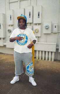 Male model wearing a custom manufactured oversized graphic tee and matching shorts set